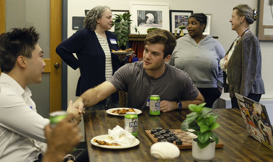 Student networks with others during lunch