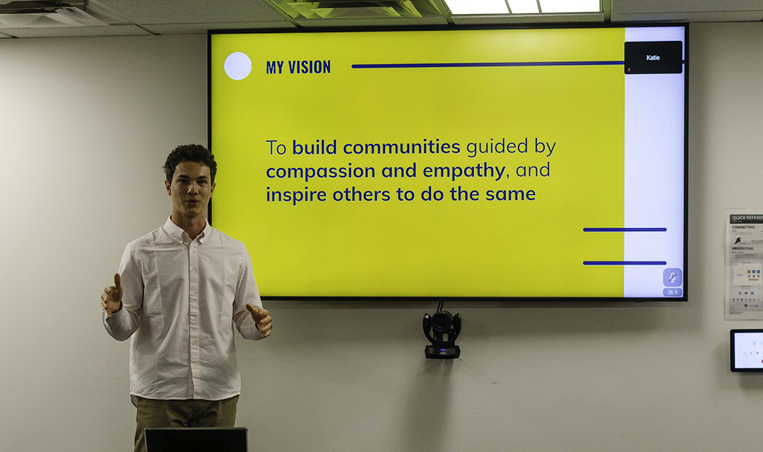 Student gives presentation in conference room