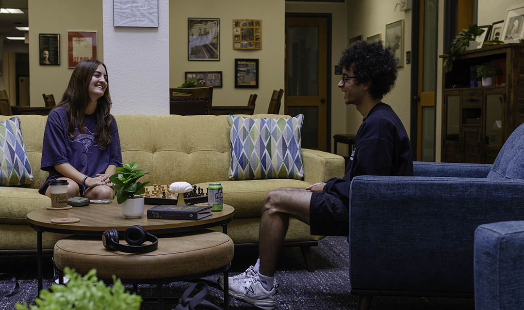 Students talk in student lounge area