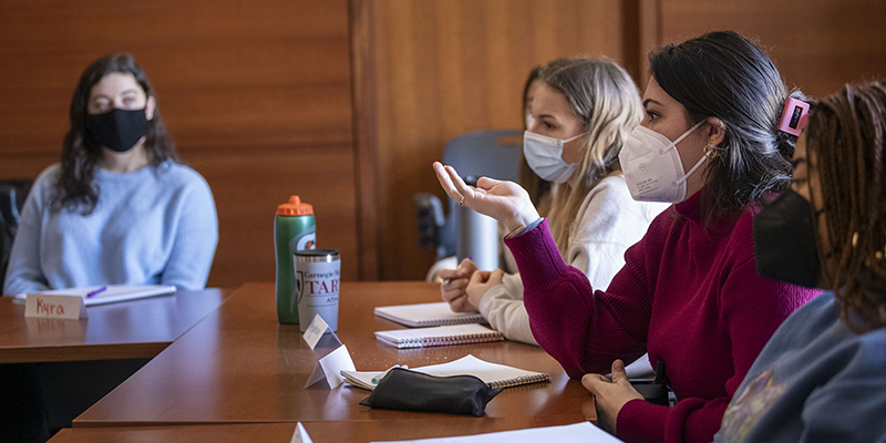 Students at a table having a discussion